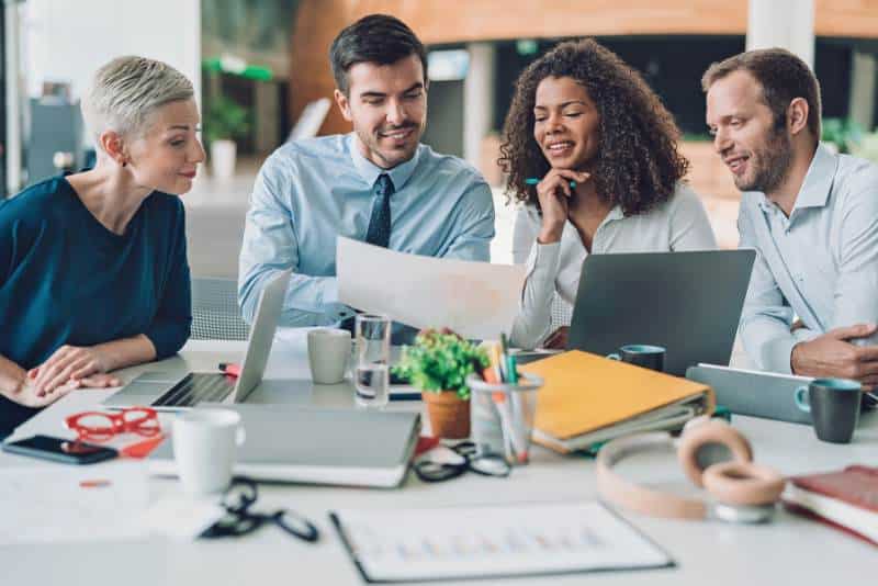Team meeting to discuss when it's time to hire a Fractional CMO